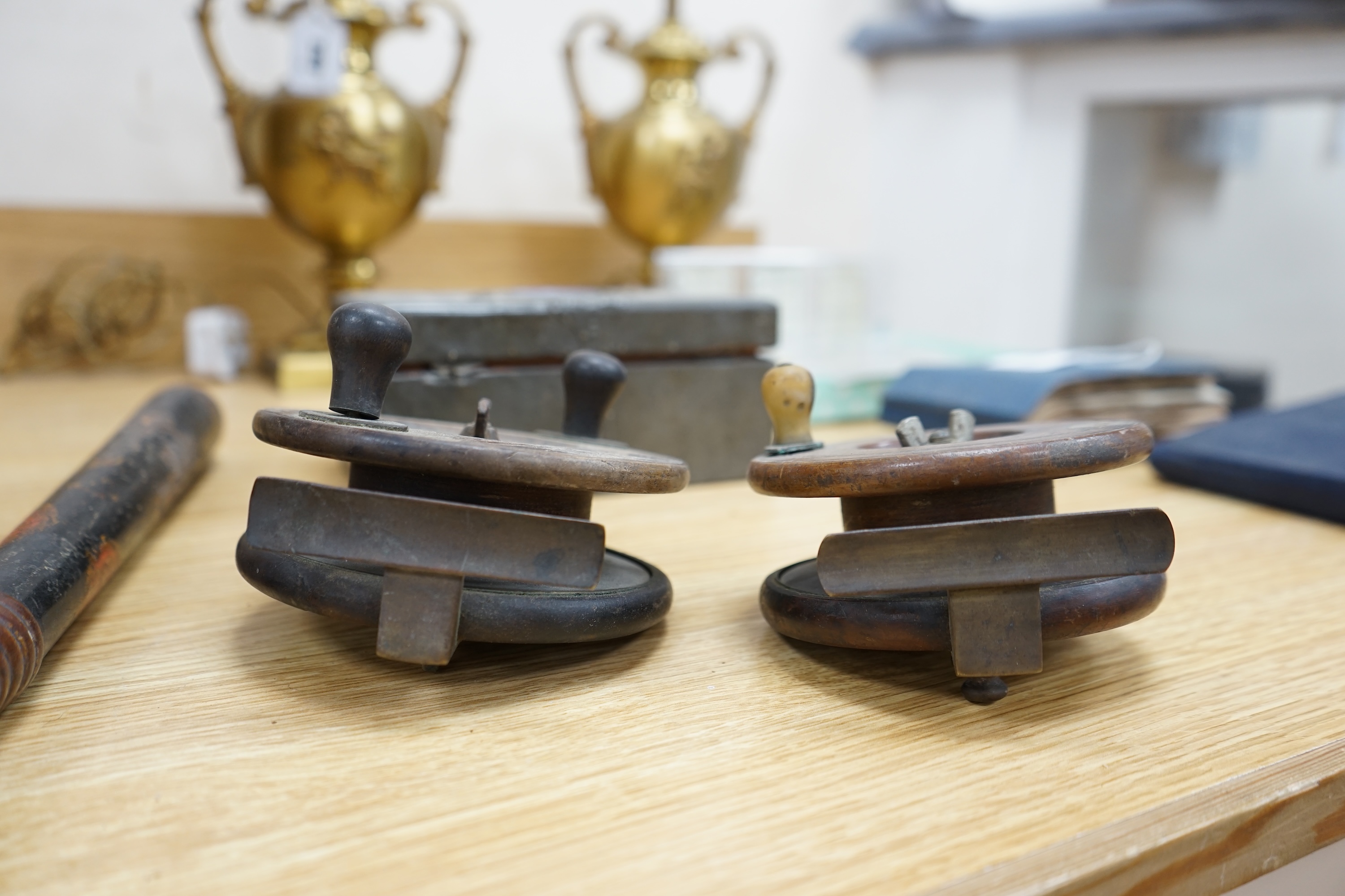 Two wooden fishing reels, a Victorian truncheon and an Arts and Crafts pewter box with enamel roundel. Truncheon 43cm long., Condition - all items worn